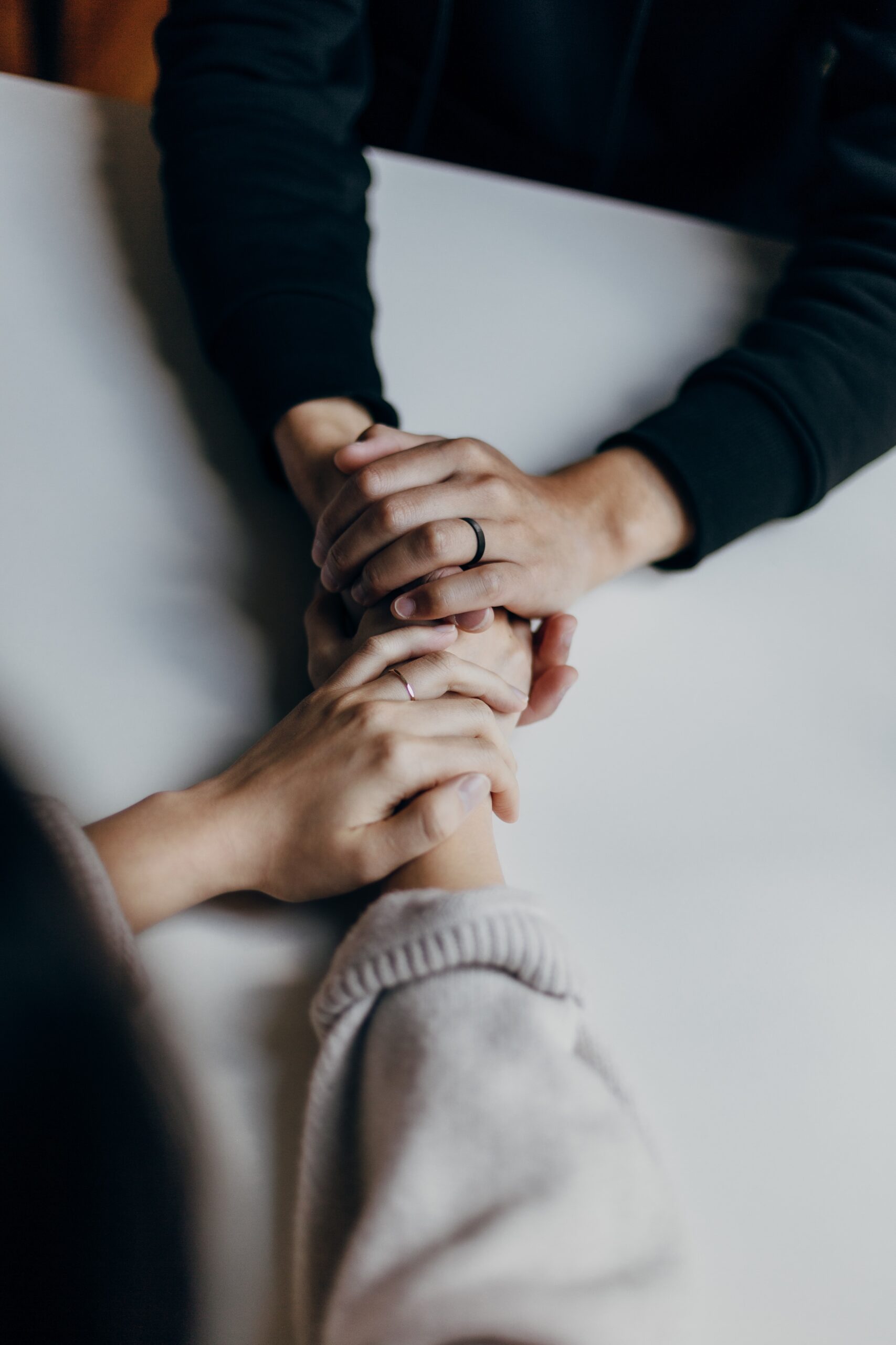 two people holding hands during depression